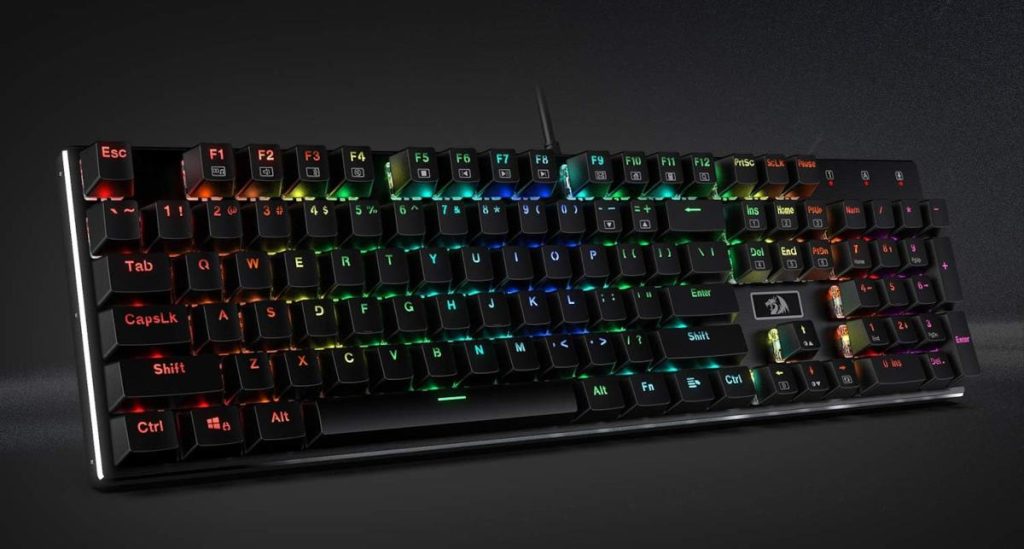 RGB backlit black Redragon K556 mechanical keyboard on black background