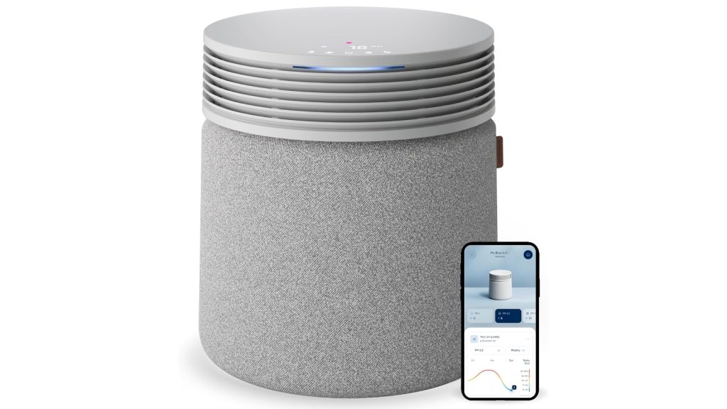 Large grey cylindrical BLUEAIR Blue Signature Air Purifier with smart phone displaying app functionality