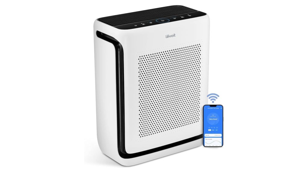 White rectangular Levoit air purifier shown next to smart phone to illustrate Wi-Fi functionality